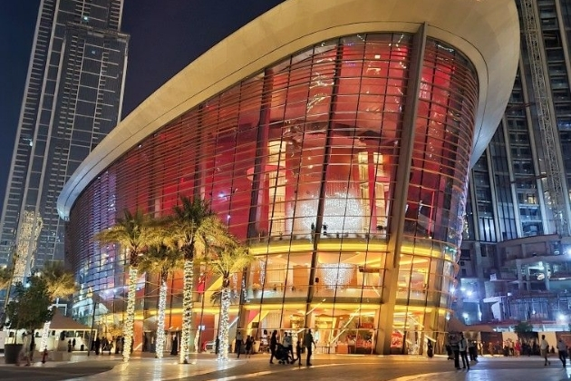 Stunning exterior view of Dubai Opera lit up at night in Downtown Dubai