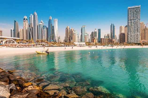Scenic view of Jumeirah Beach Residence (JBR) with modern skyscrapers and palm-lined walkways