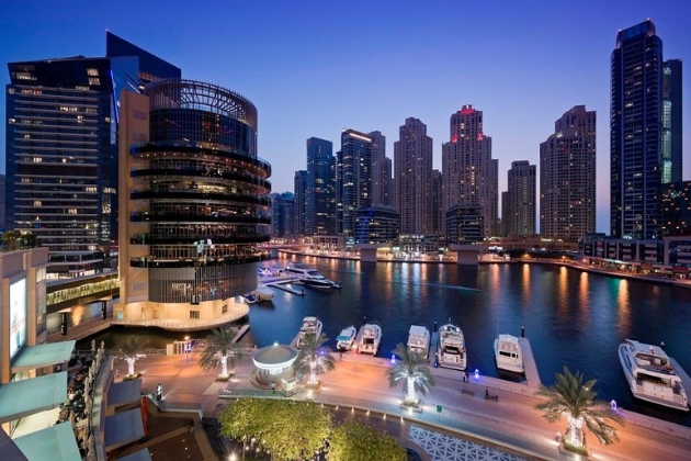 Shoppers exploring Dubai Marina Mall, featuring international brands, dining, and entertainment, with nearby options like Mall of the Emirates and The Walk at JBR.
