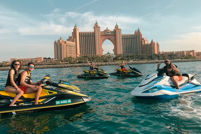 Tourists riding jet skis in front of Atlantis The Palm hotel in Dubai.