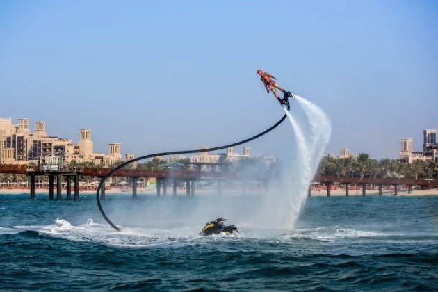 Flyboard rider soaring high like superhero